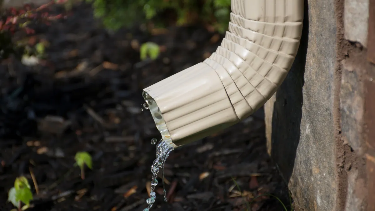 Professional downspout installation on a Hartford home